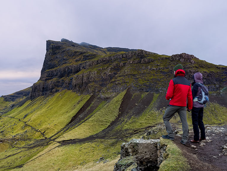 Two people standing on a hilltop, Scotland 