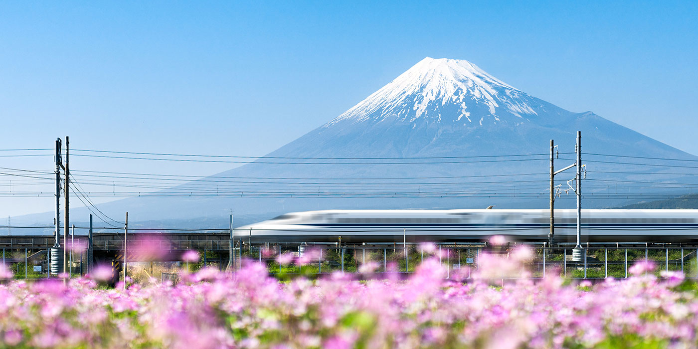 Shinkansen bullet train in front of Mount Fuji Japan
