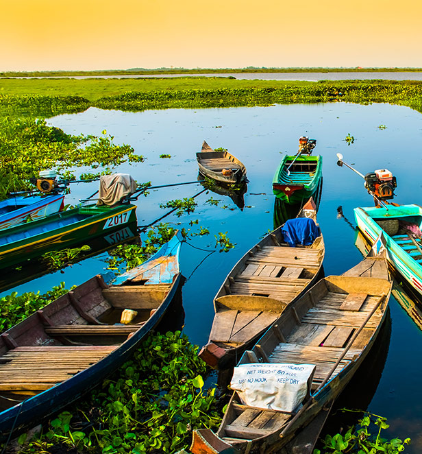 Wooden boats docked at Phnom Krom, Cambodia