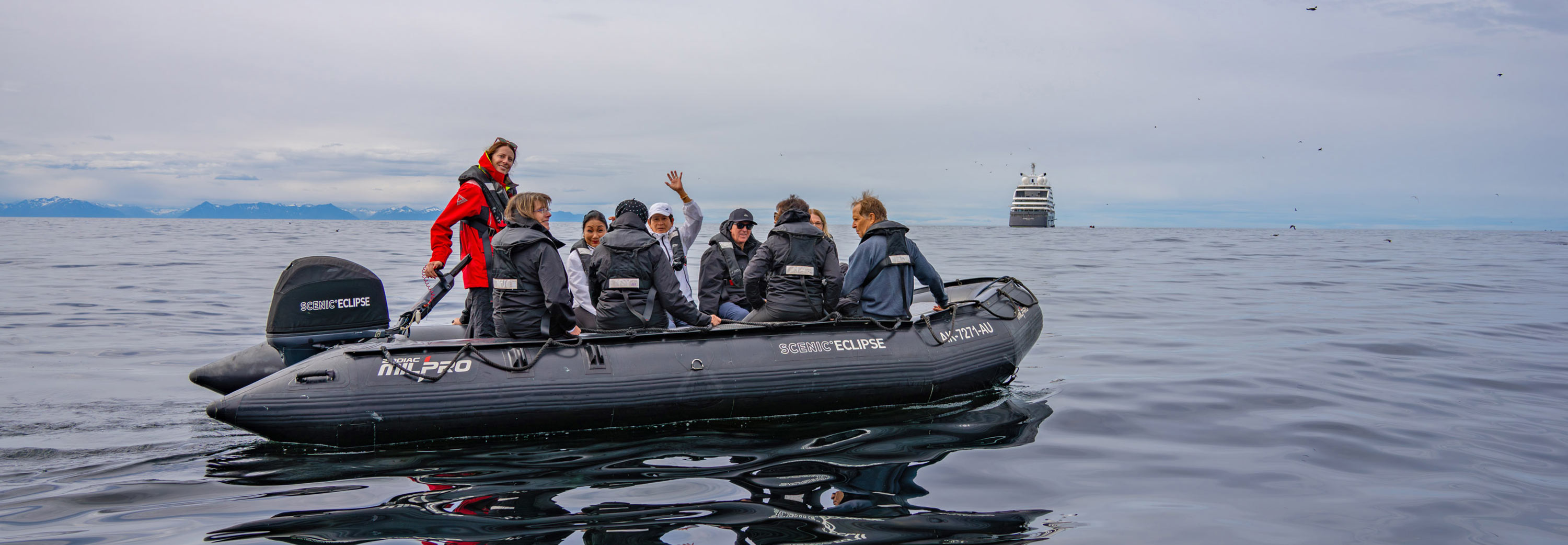 Zodiac cruising across the Arctic Circle