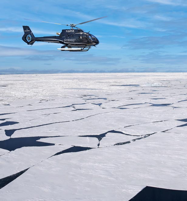 Scenic Eclipse Helicopter flying in Antarctica