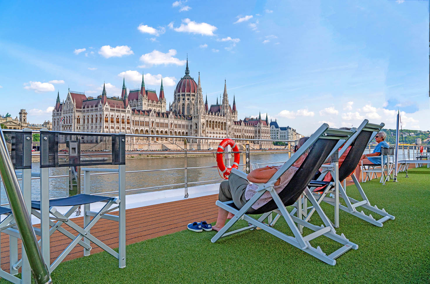 Scenic river cruise ship Sundeck overlooking the Budapest Parliament Building
