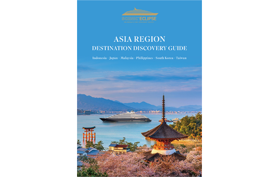 The front cover of the Asia Region Discovery Voyage Guide. The sky is blue and a mountain range can be seen in the background.