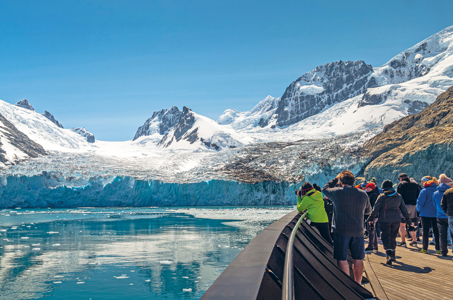 Guests taking photos of the Arctic Fjords