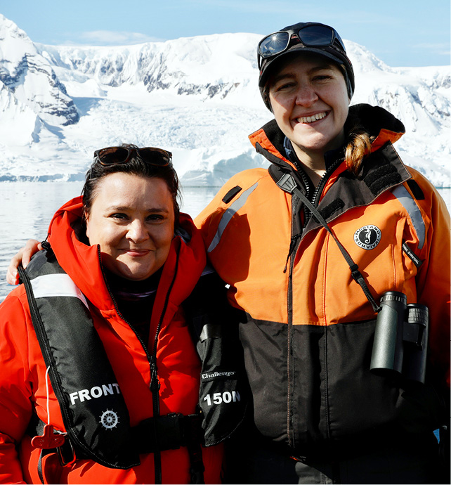 Scottish comedian, television presenter, writer and panellist Susan Calman standing with another woman in front of snow covered mountains