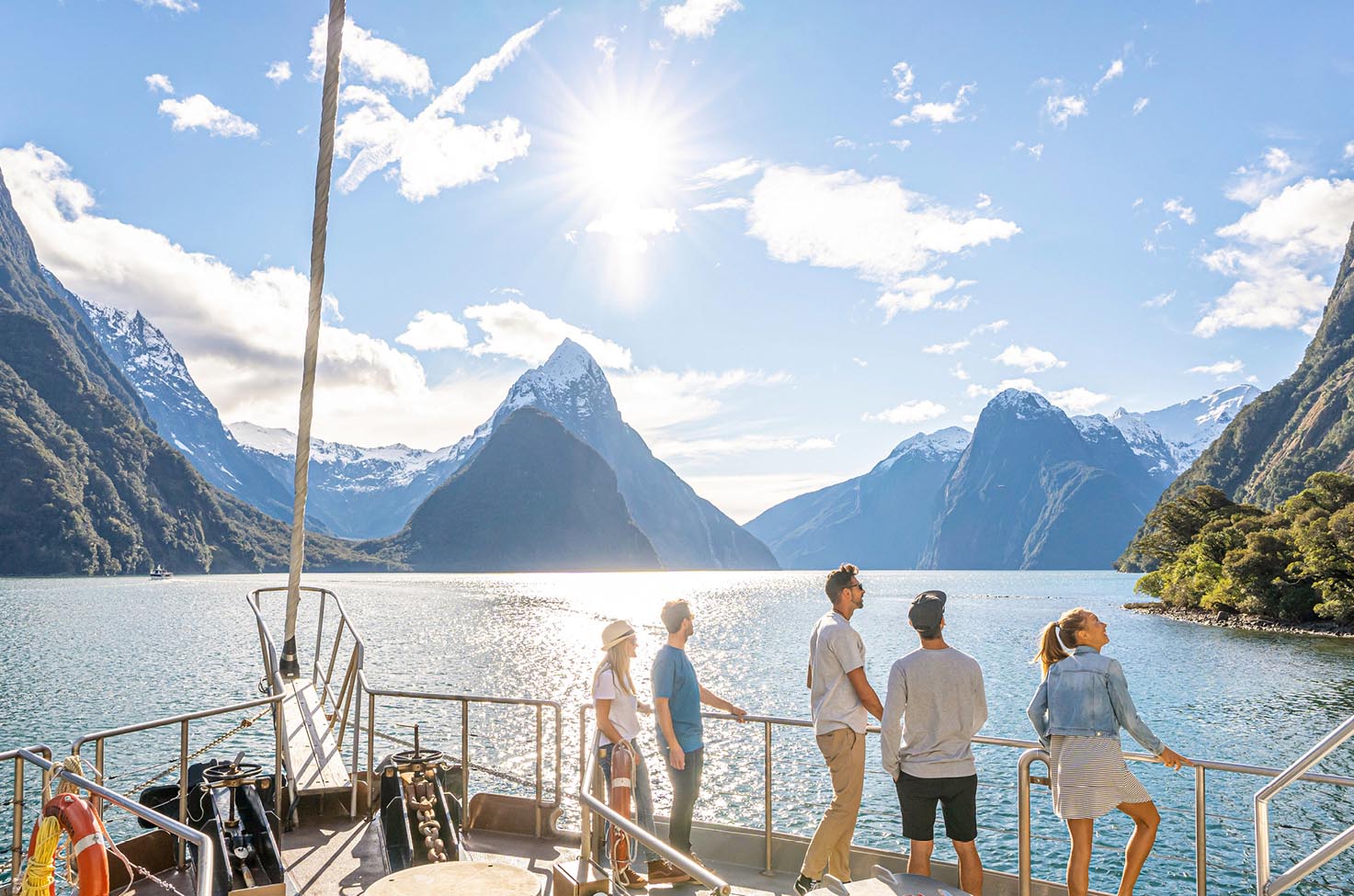 Guests witnessing the stunning Milford Sound from the Milford Mariner. 