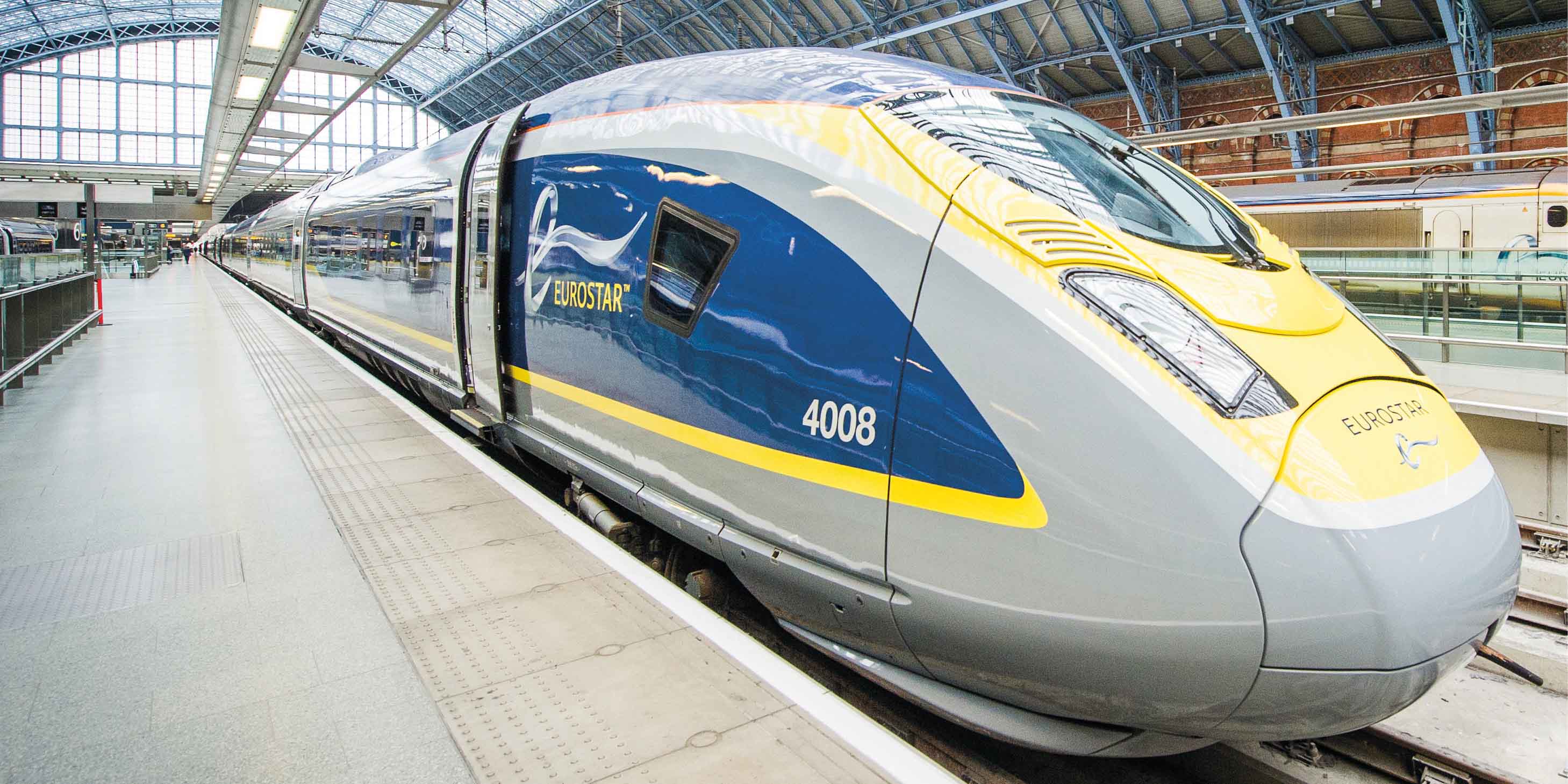 Front end of a Eurostar train in a terminal waiting to depart.